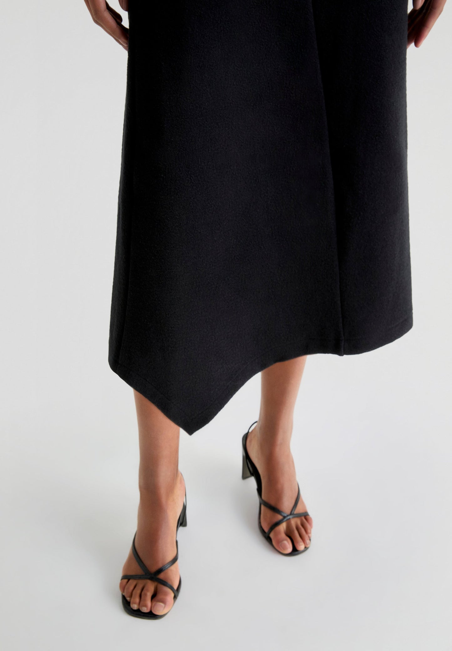 ASYMMETRIC KNIT MIDI SKIRT