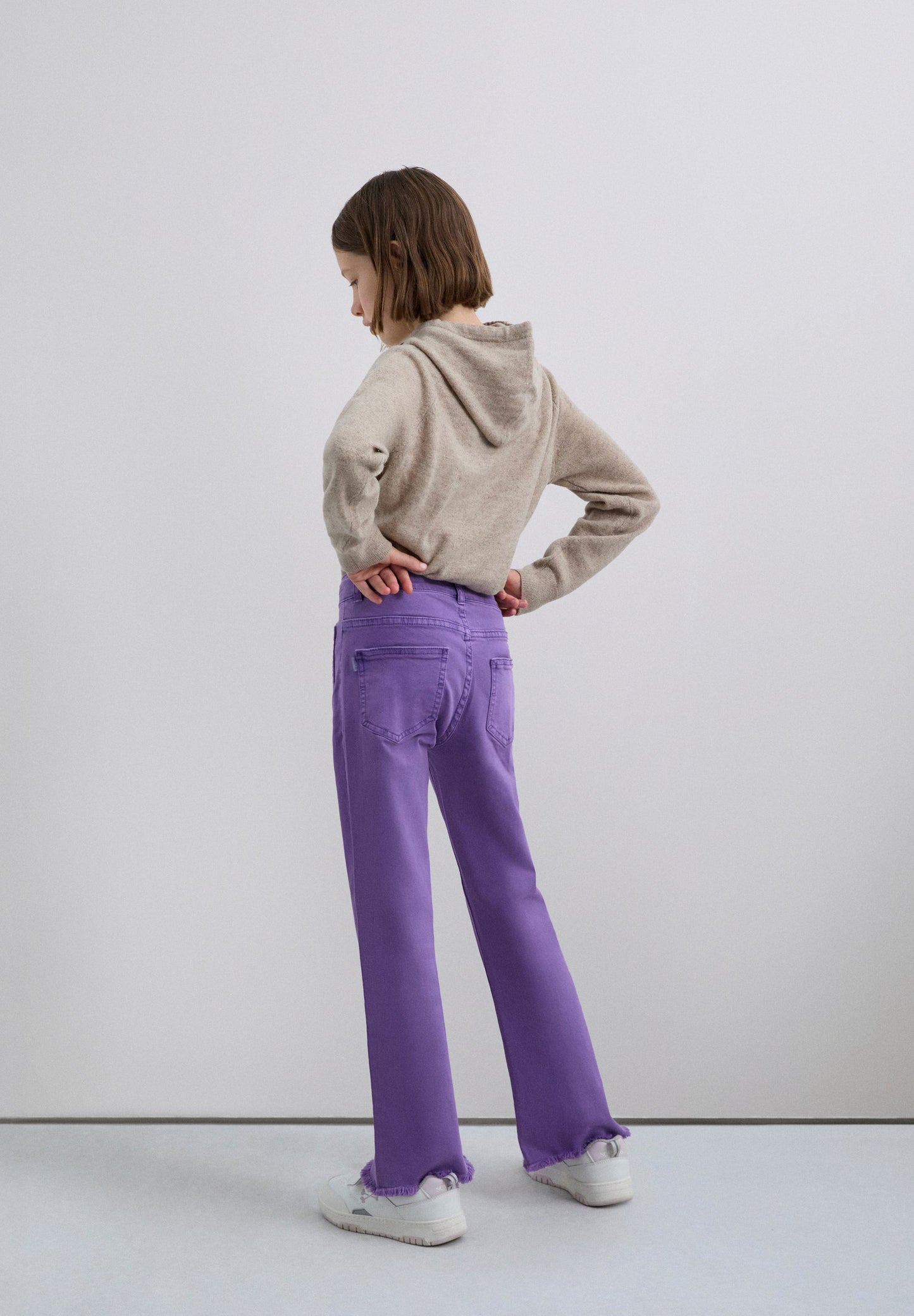 FLARED TROUSERS WITH FRINGING