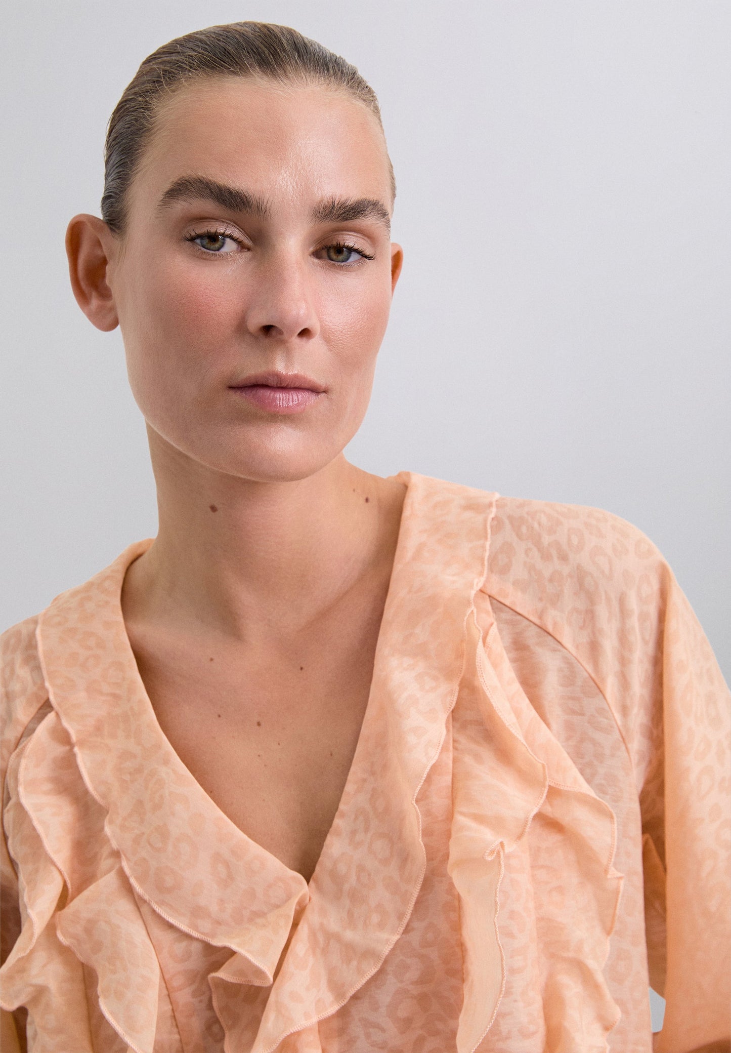 ANIMAL PRINT BLOUSE WITH RUFFLES