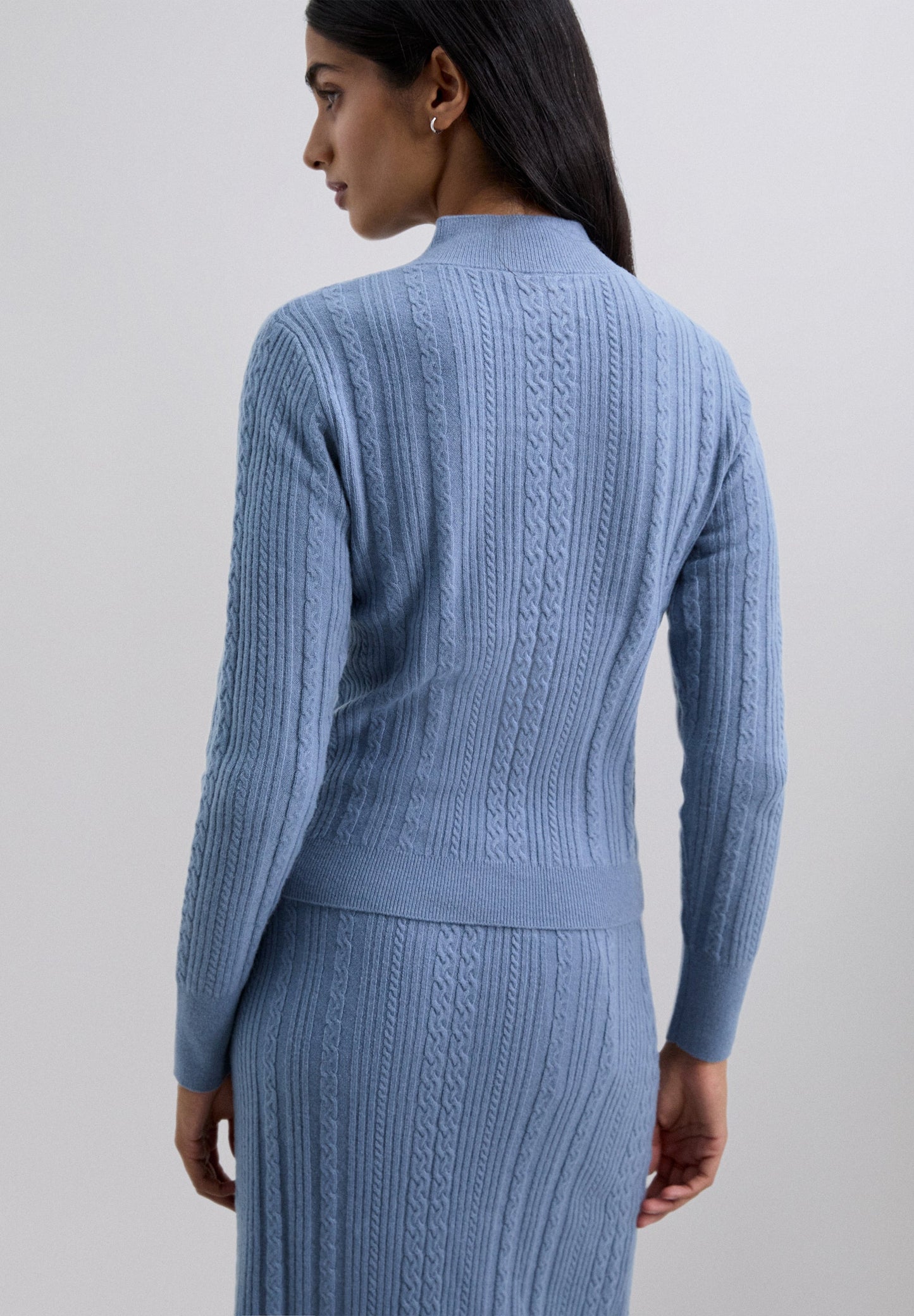 CABLE KNIT SWEATER WITH CUT-OUT