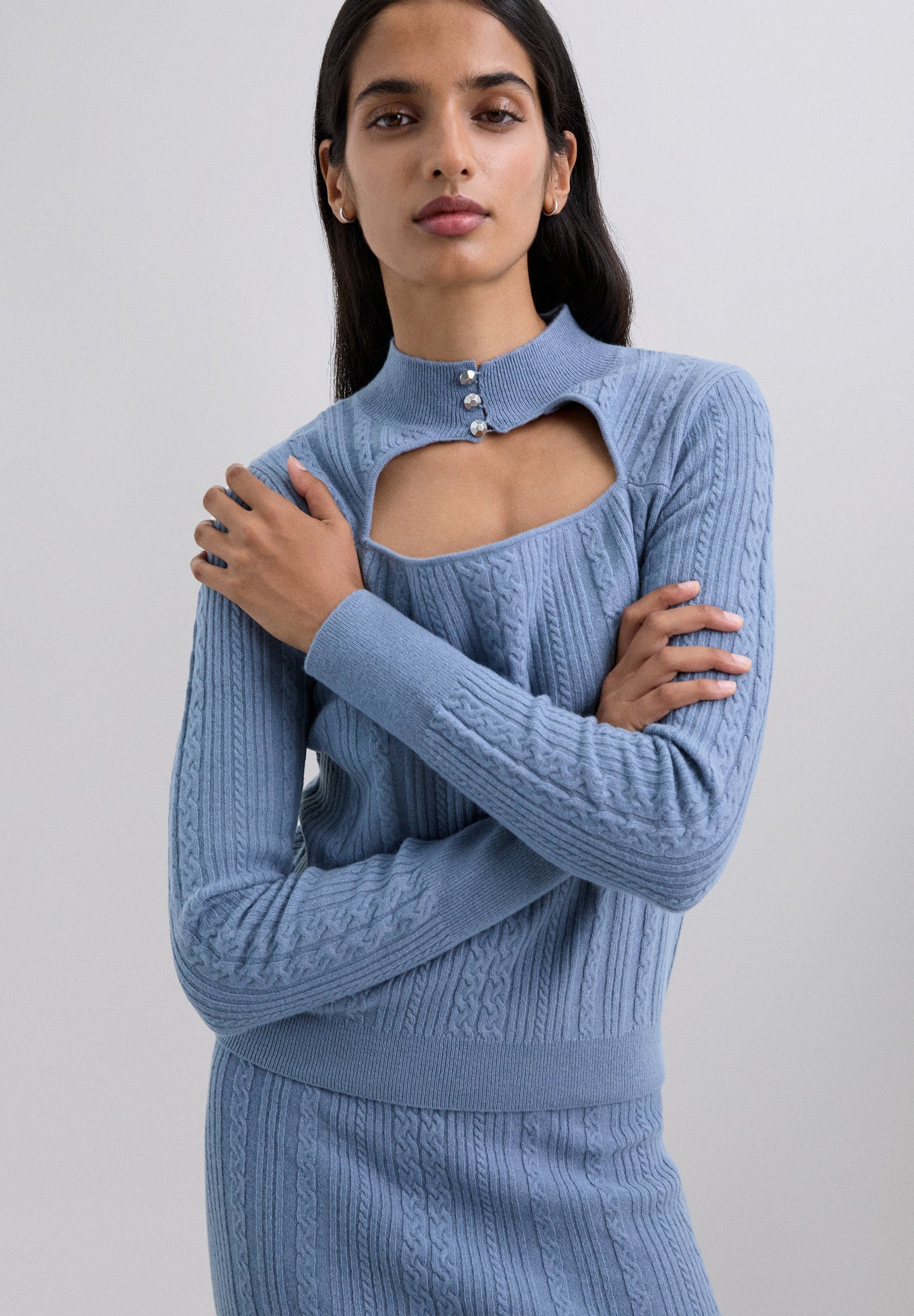 CABLE KNIT SWEATER WITH CUTOUT