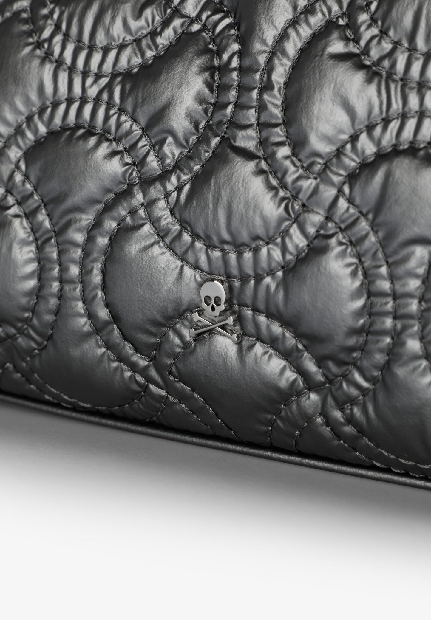 QUILTED TOILETRY BAG WITH SKULL