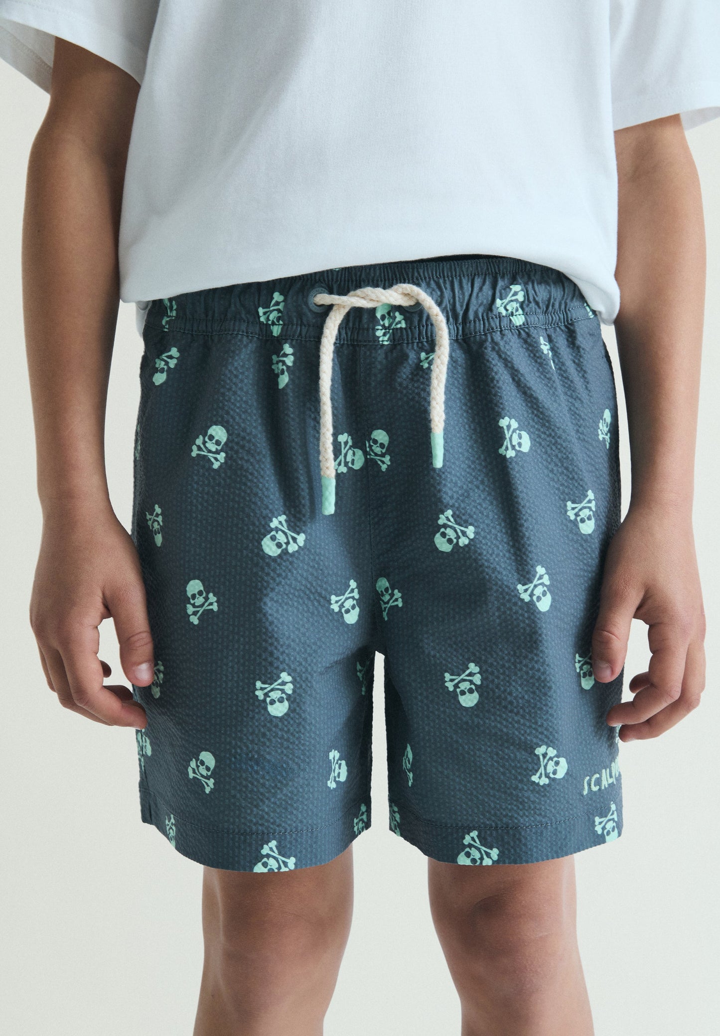 SWIMMING TRUNKS WITH SKULL PRINT