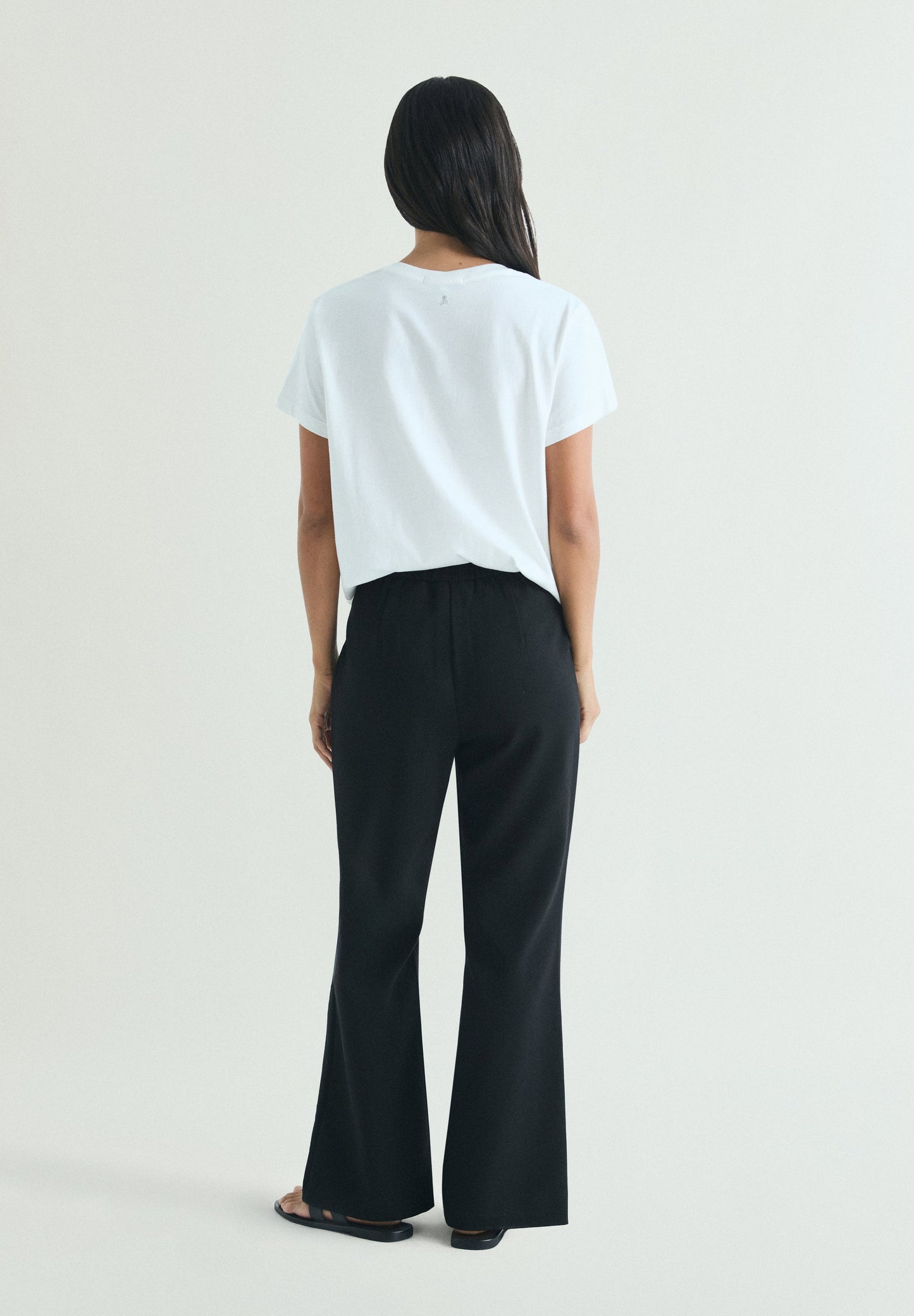 TROUSERS WITH PERFORATED DETAILS