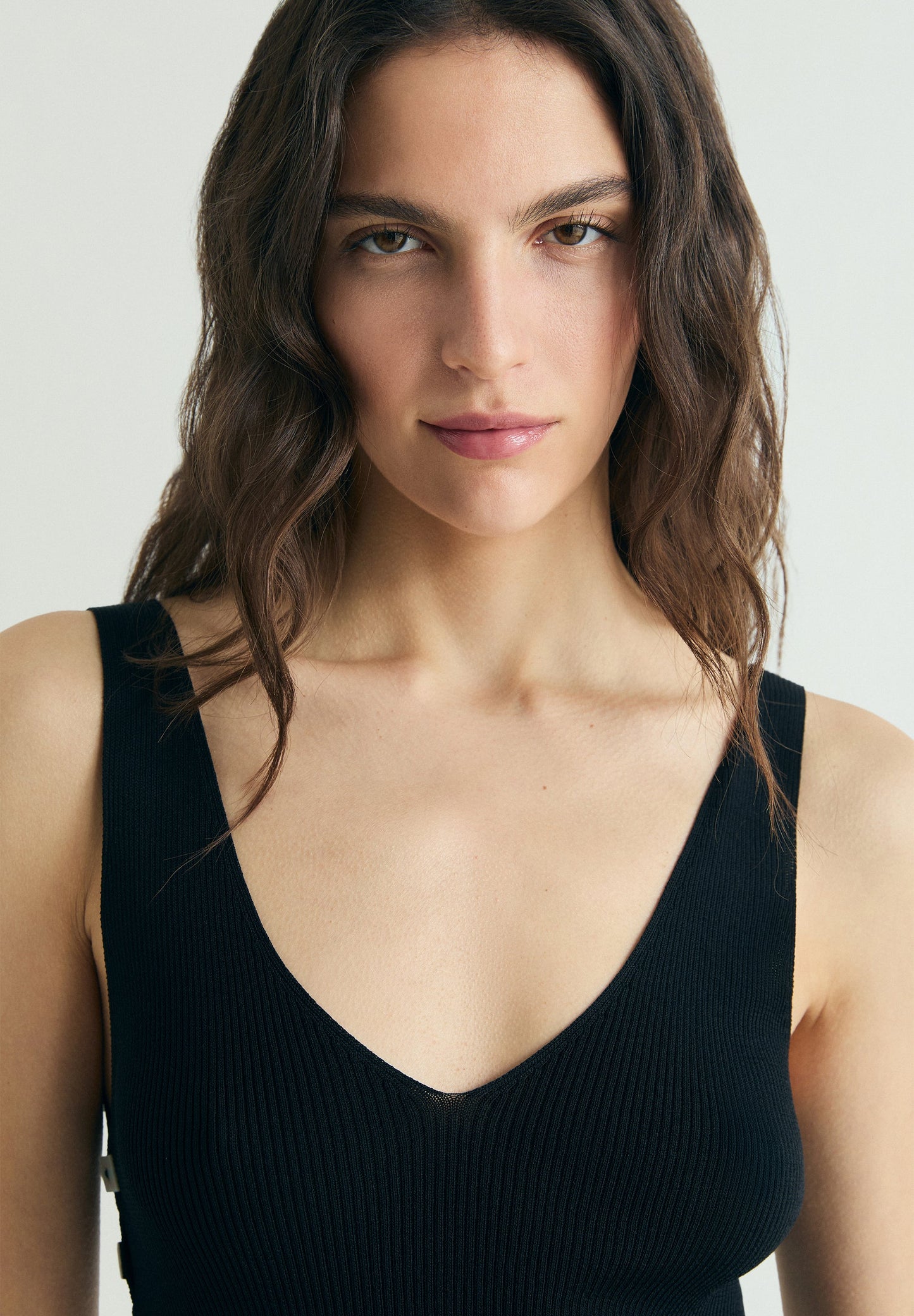 ASYMMETRIC KNIT TOP WITH APPLIQUÉS