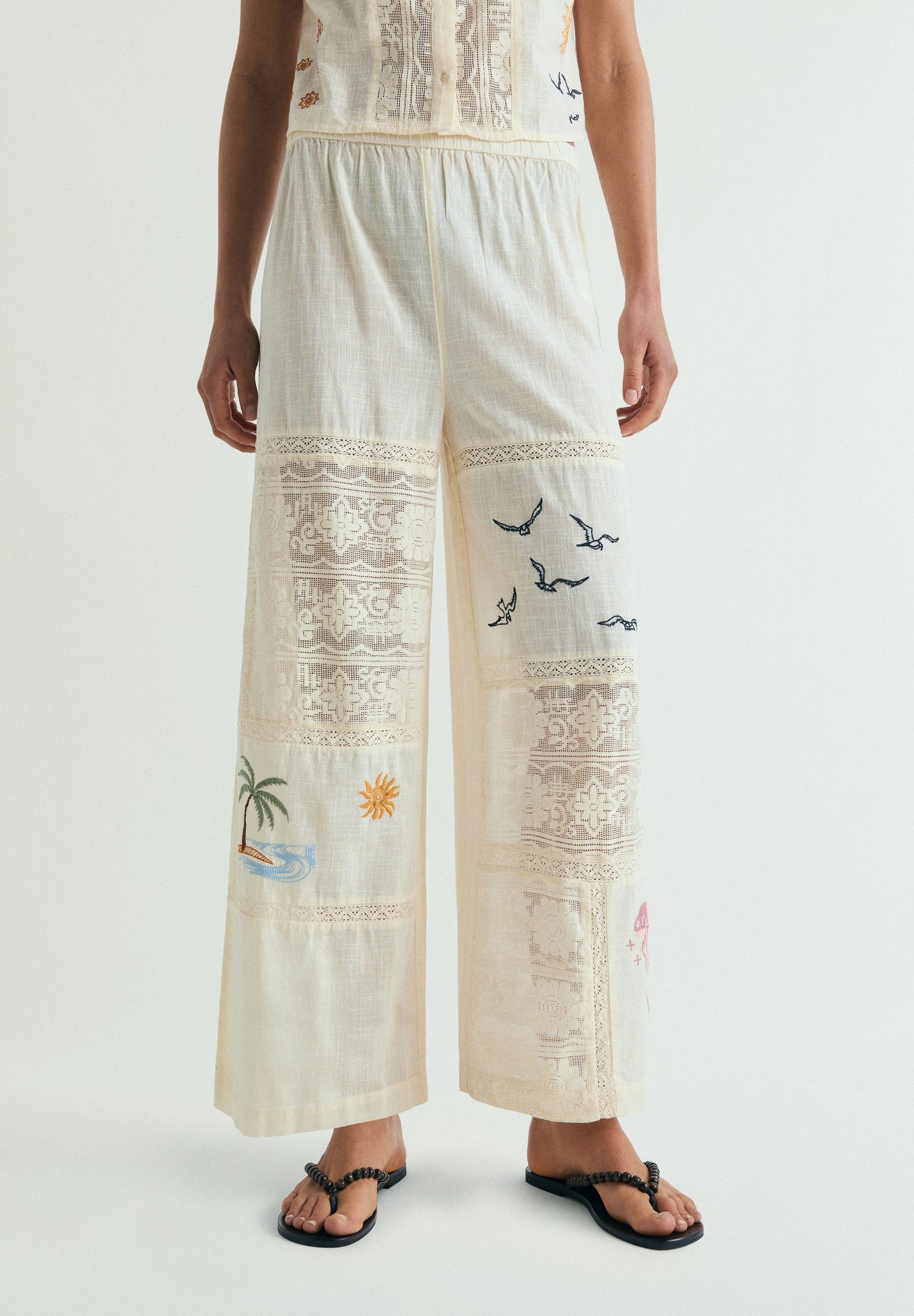 TROUSERS WITH EMBROIDERY AND LACE