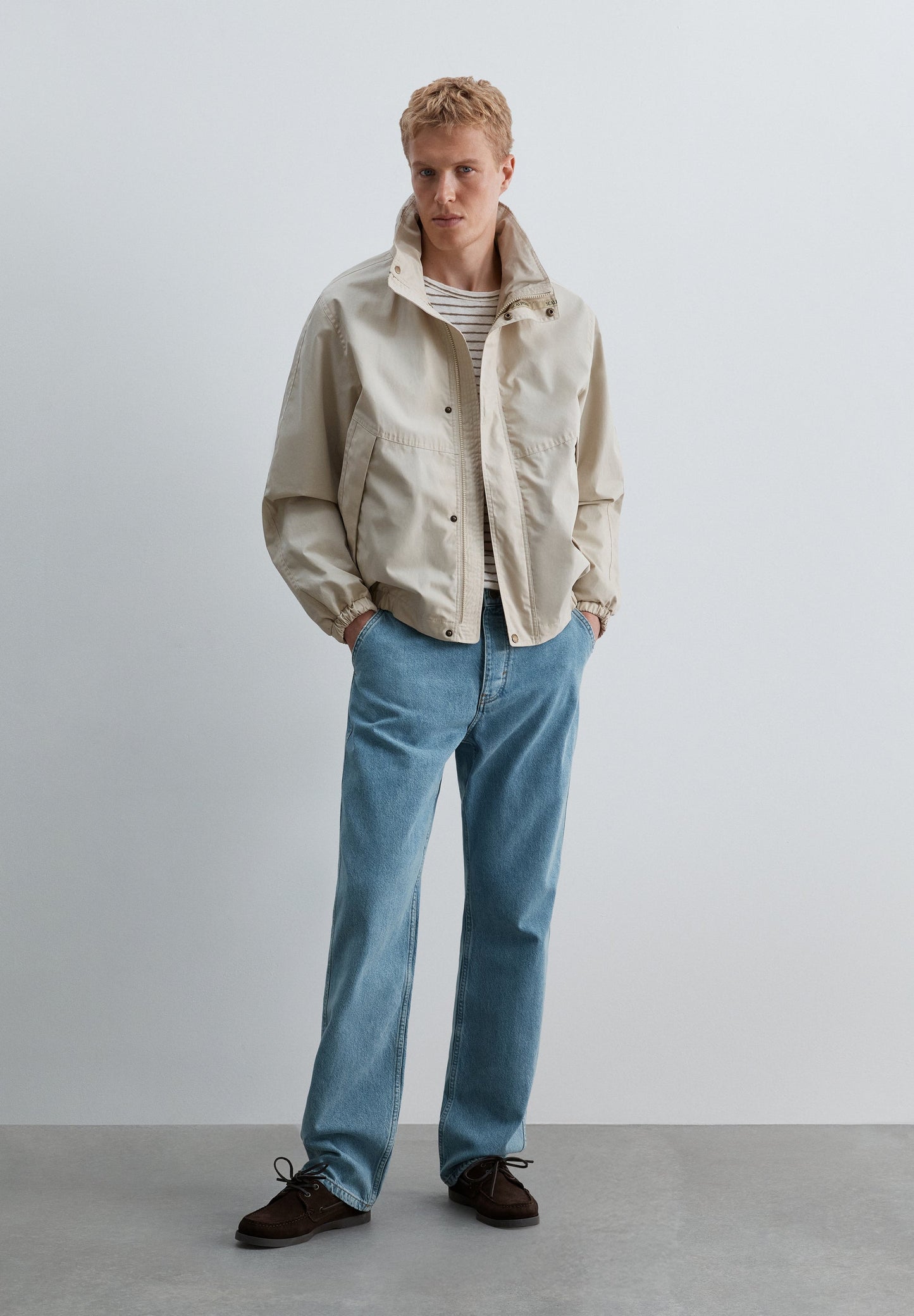 TECHNICAL JACKET WITH CONCEALED HOOD