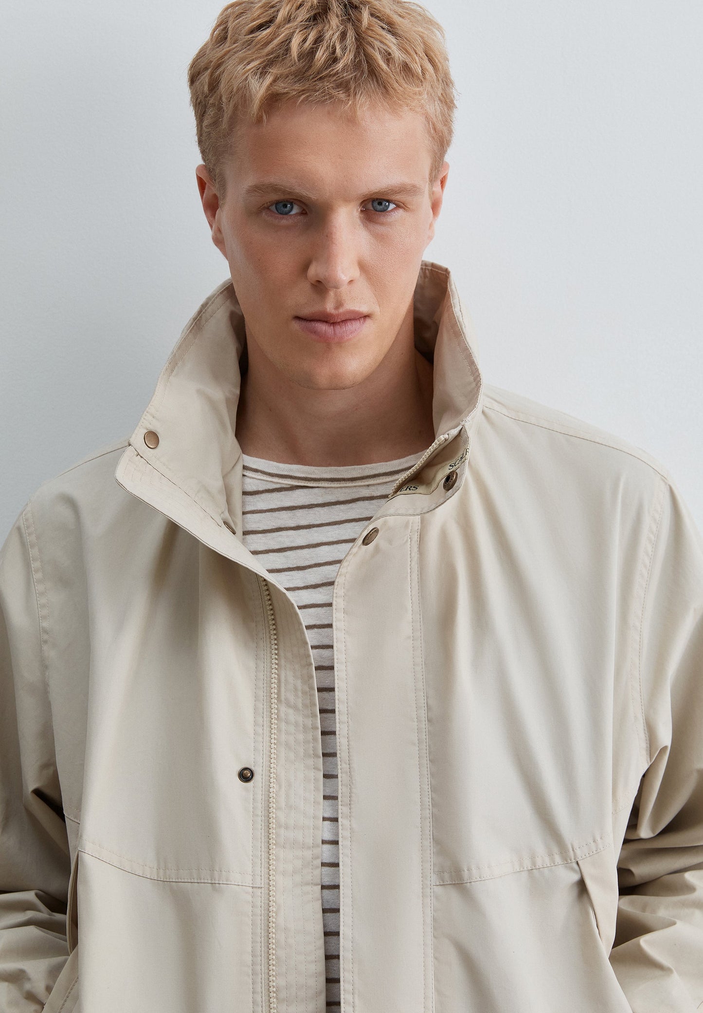 TECHNICAL JACKET WITH CONCEALED HOOD