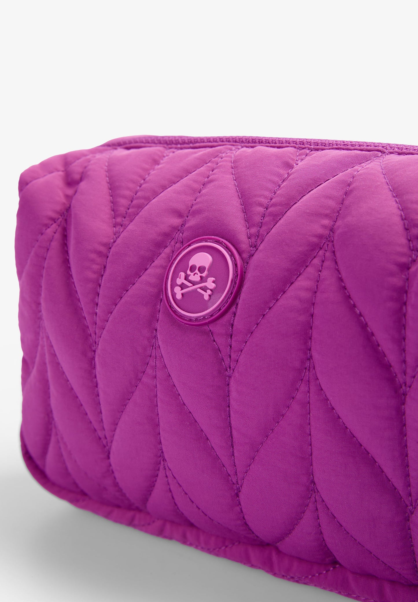 QUILTED TOILETRY BAG WITH SKULL