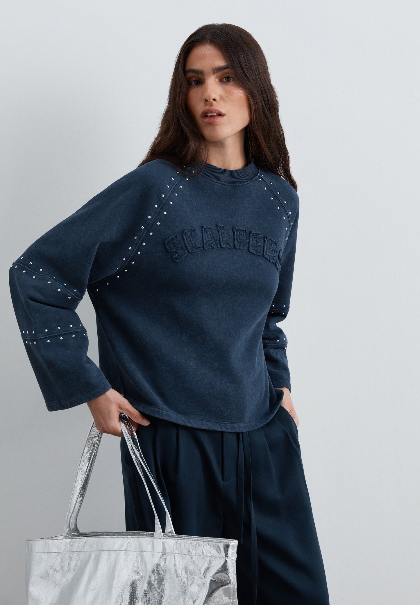 SWEATSHIRT WITH STUDS AND LOGO PATCH