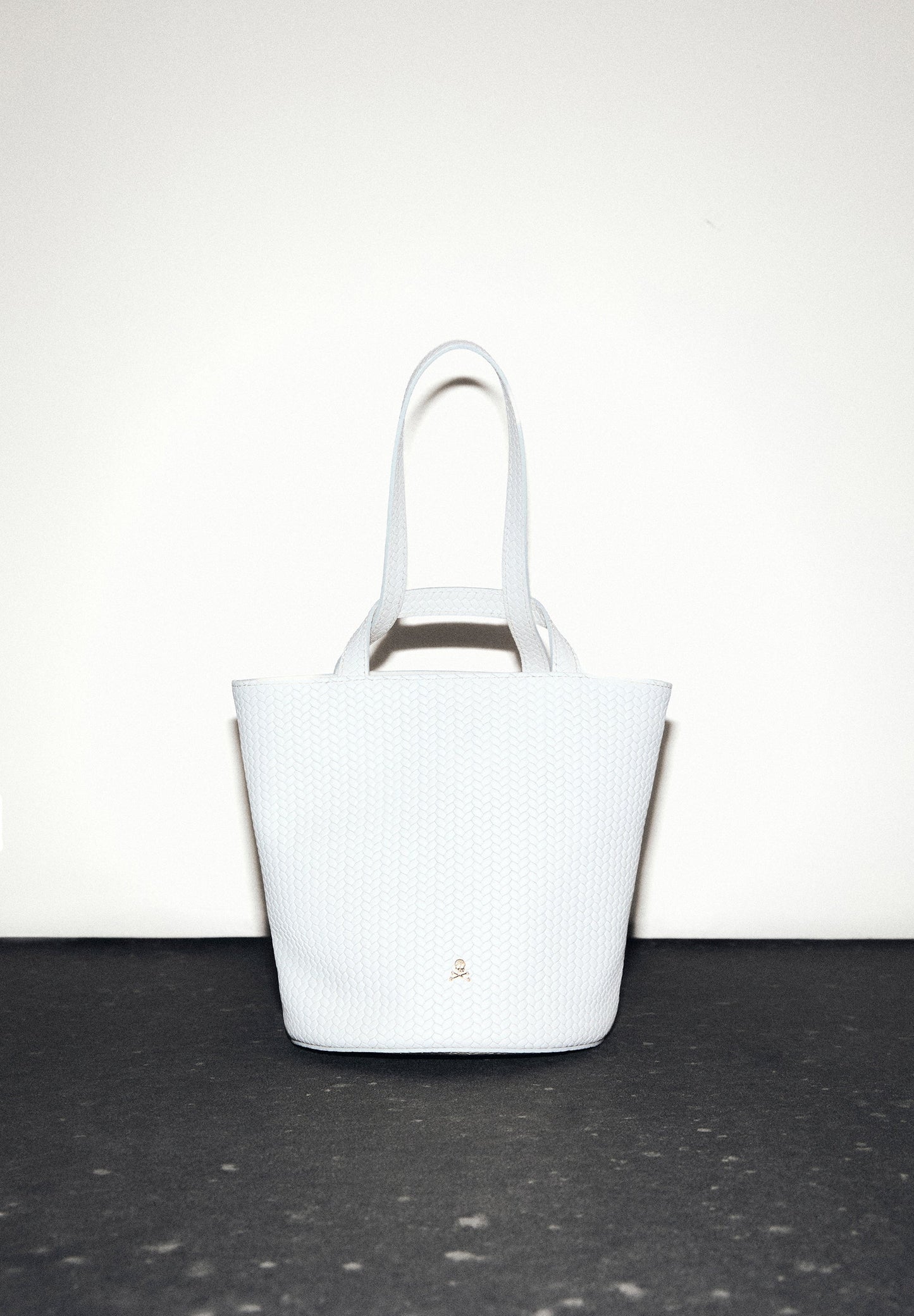 MINI BUCKET BAG IN 100% BRAIDED LEATHER