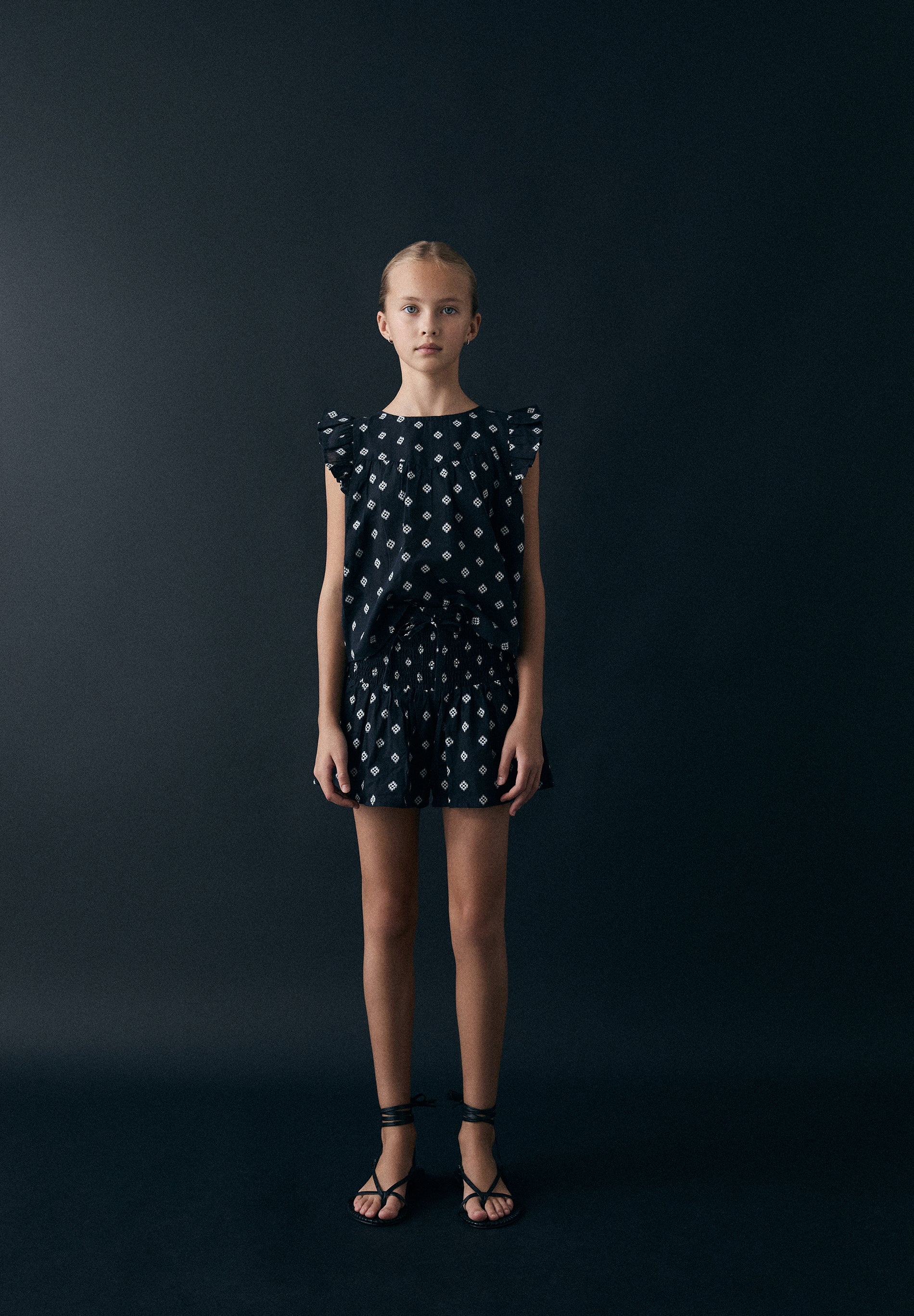 SLEEVELESS JACQUARD BLOUSE